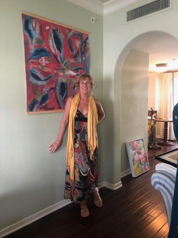Picture of Lisa Trivell next to a painting