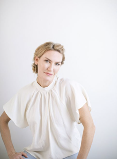 Emma Lauter in a white blouse